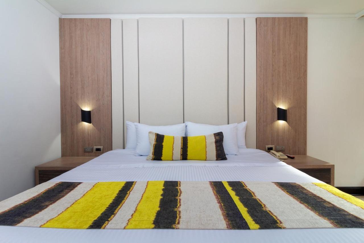 Hotel Dann Carlton Belfort Medellín Exteriér fotografie A bedroom at the hotel